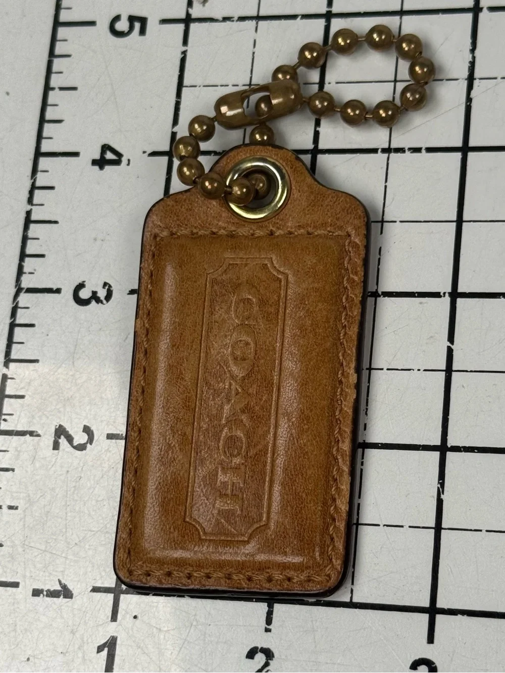 COACH Tan Leather Key Tag hang tag with Brass Ball Chain. Lg. 3 by 1.25 inches